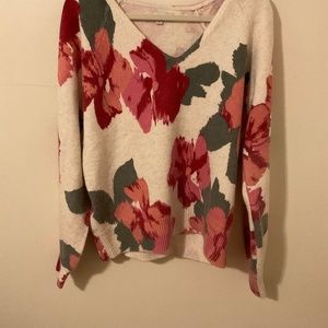 Sweater of white and rose colored flowers. Never worn